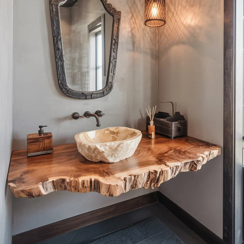 Live edge wood bathroom vanity with stone vessel sink and rustic wall mirror