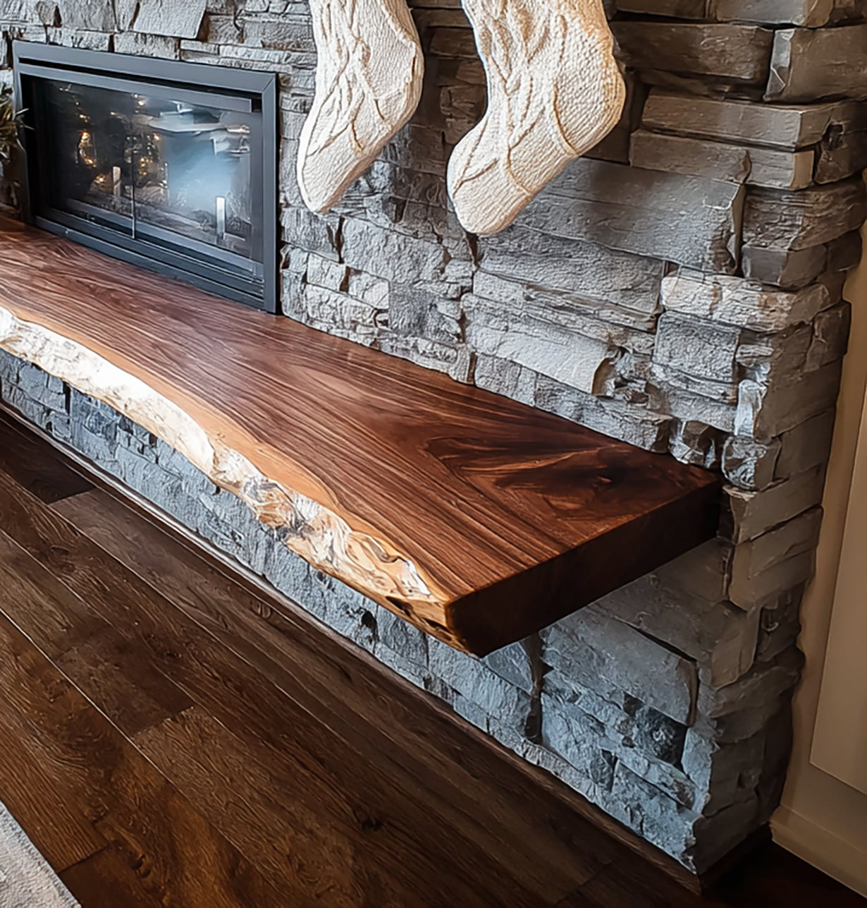 Rustic stone fireplace with natural live edge wood mantel and hanging cream knitted Christmas stockings