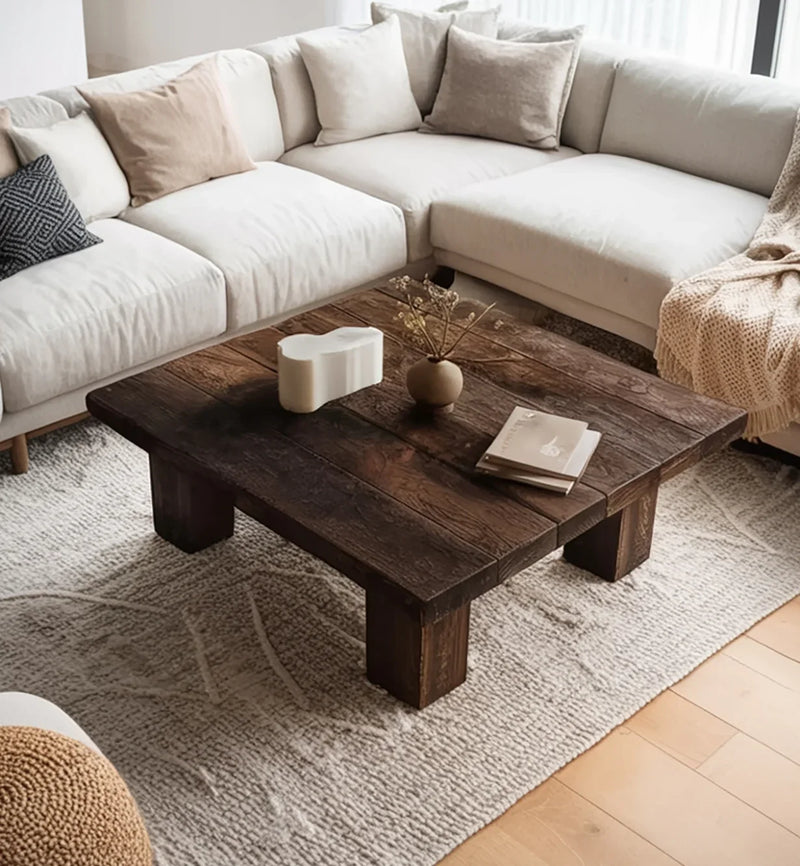 Solid wood coffee table with live edge design in a modern living room with neutral sofa and decor.