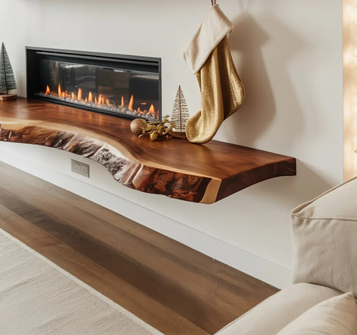 Modern living room with floating live edge wood mantel, gas fireplace, gold Christmas stocking, and holiday decor