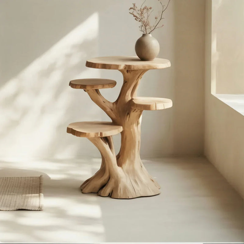 Solid wood tree-shaped bookshelf with live edge shelves in a sunlit minimalist room
