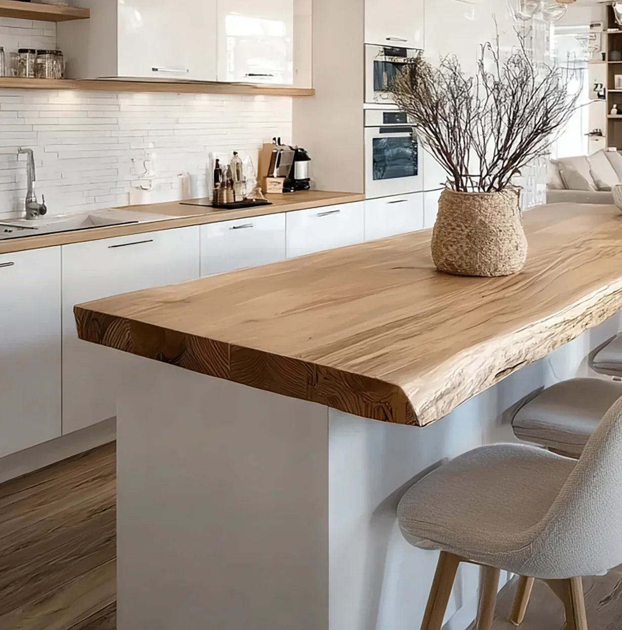 Live edge solid wood kitchen island countertop with modern white cabinets and bar stools