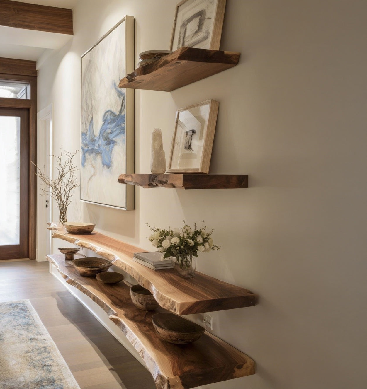Natural live edge wood wall shelves with decorative bowls, vases, and artwork in modern hallway