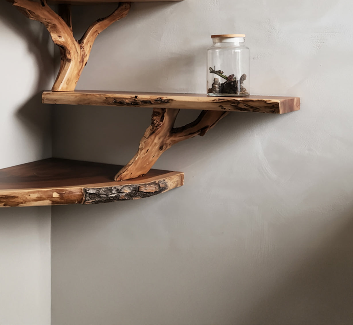 Rustic live edge wood corner shelves with natural branches and glass jar decor