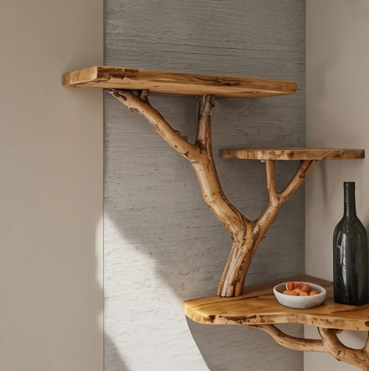 Rustic wooden wall shelves with natural branch supports, featuring a bowl of nuts and a black bottle