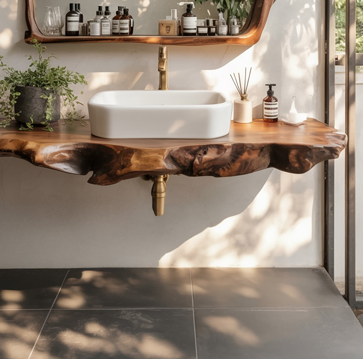 Modern bathroom sink with white rectangular basin on live edge wood countertop and brass faucet