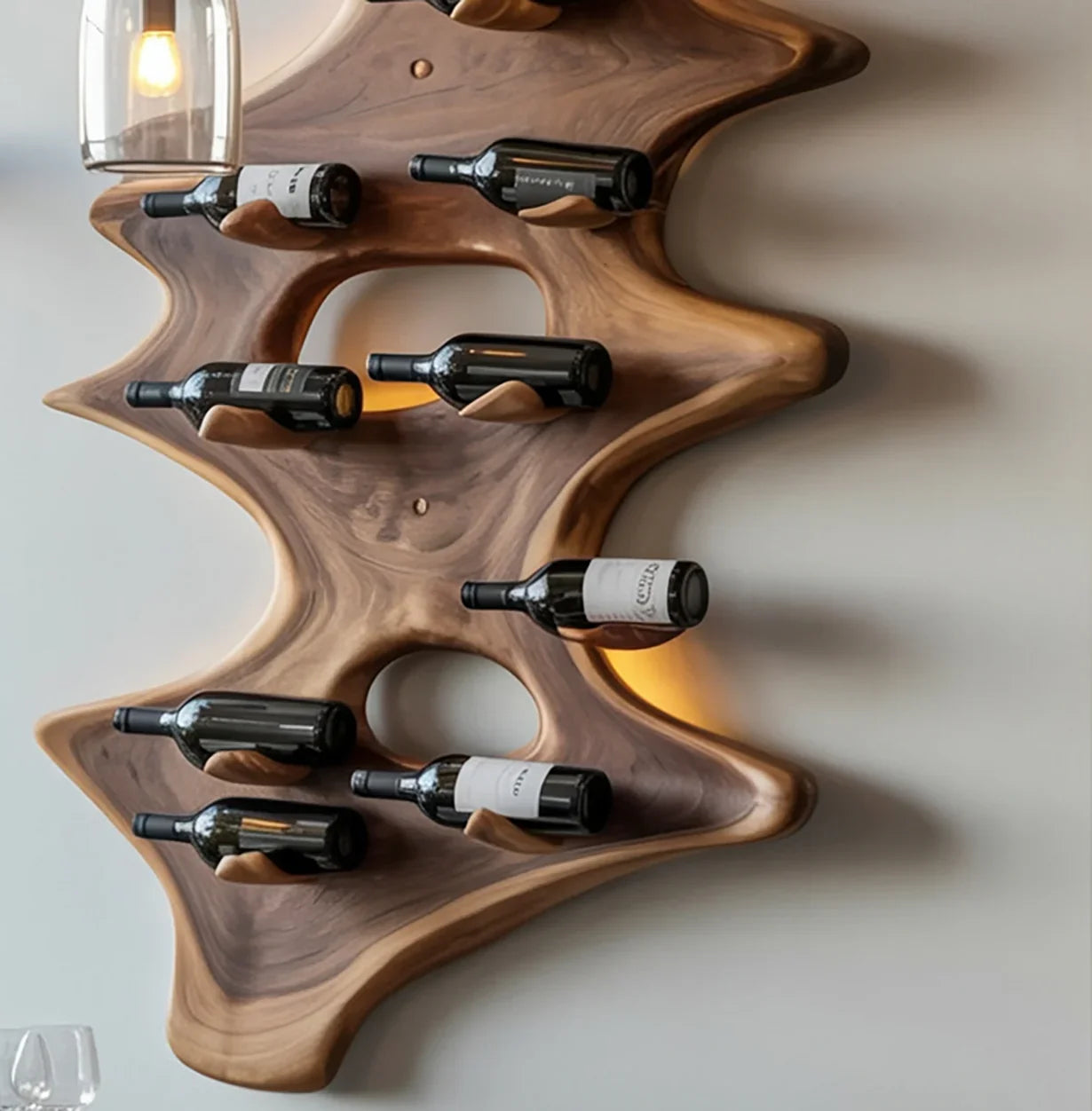 Modern wooden wall-mounted wine rack holding eight bottles in a unique sculptural design