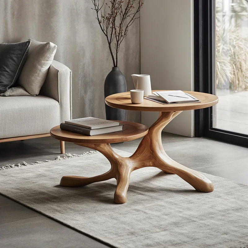Solid wood live edge nesting coffee tables in modern living room with soft rug and books