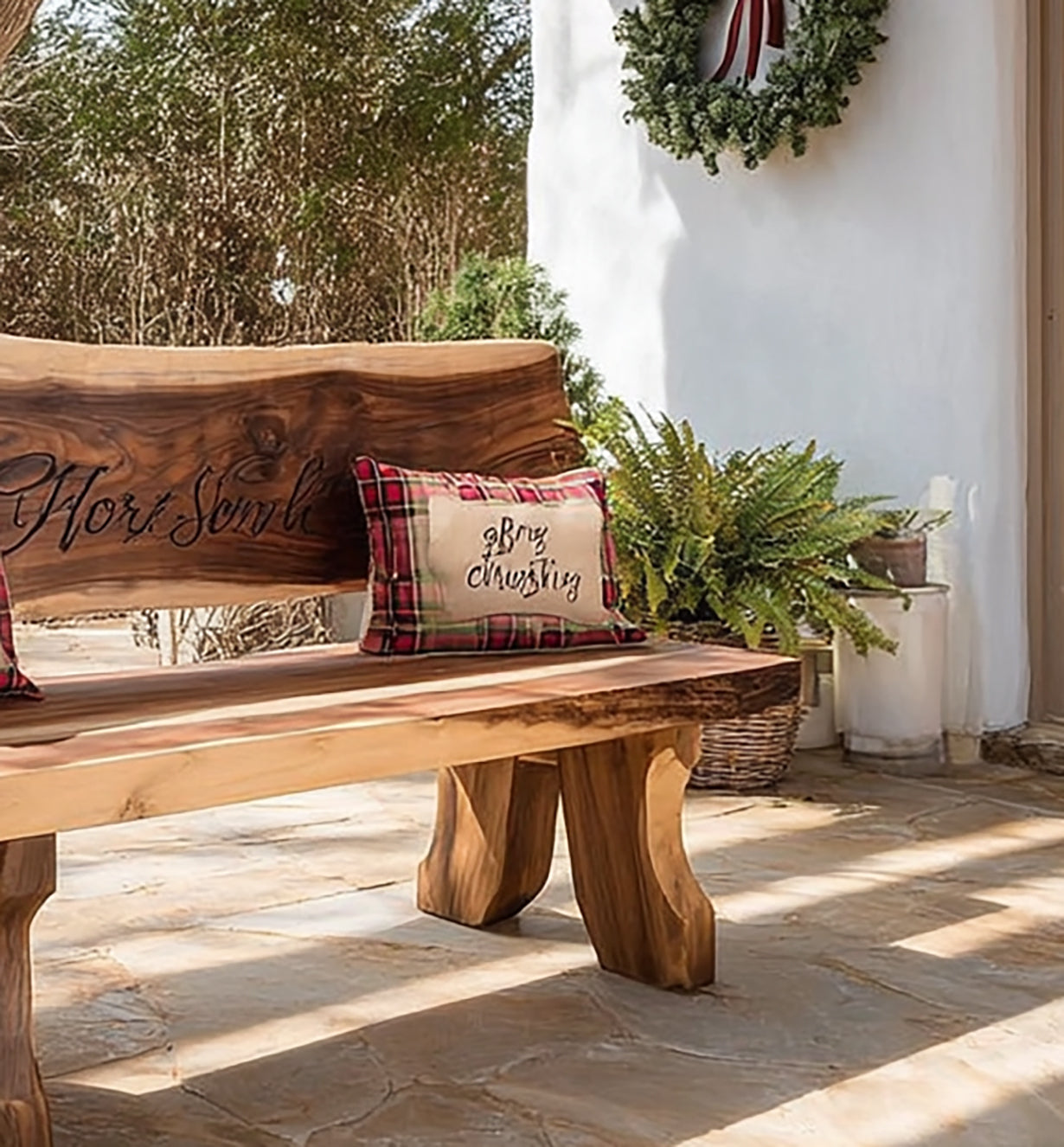 Rustic wooden bench with plaid pillows and Thanksgiving decor on stone patio in cozy outdoor setting