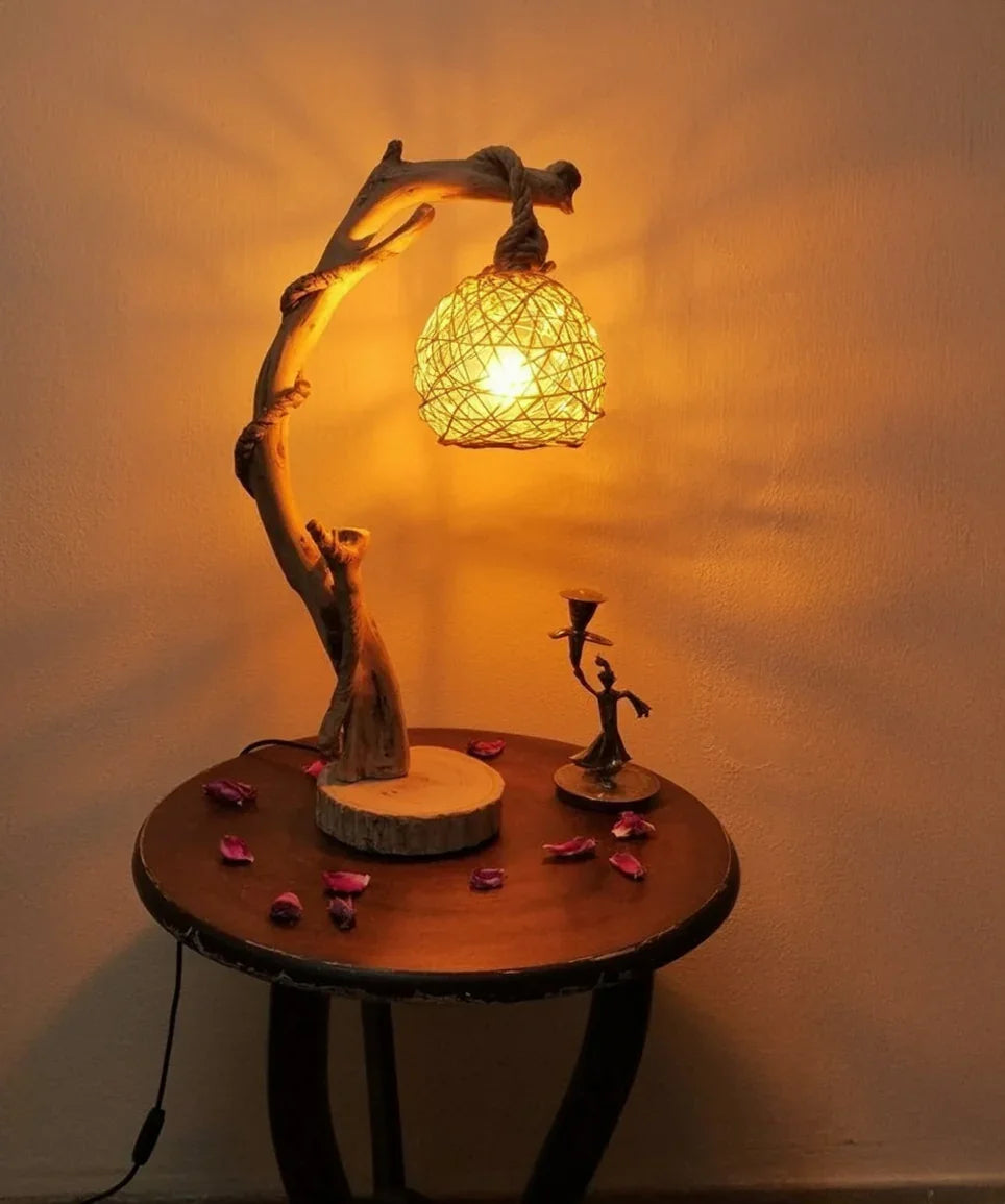Rustic wooden table lamp with woven shade on round table, ambient lighting, decorative petals