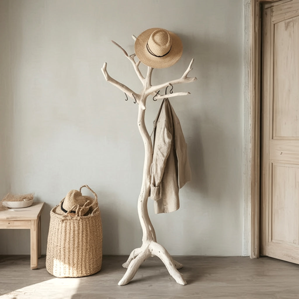 Natural wooden coat rack with beige jacket and straw hat in neutral minimalist room