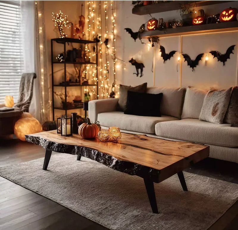 Cozy living room with Halloween decor, pumpkin on wooden coffee table, string lights, and beige sofa