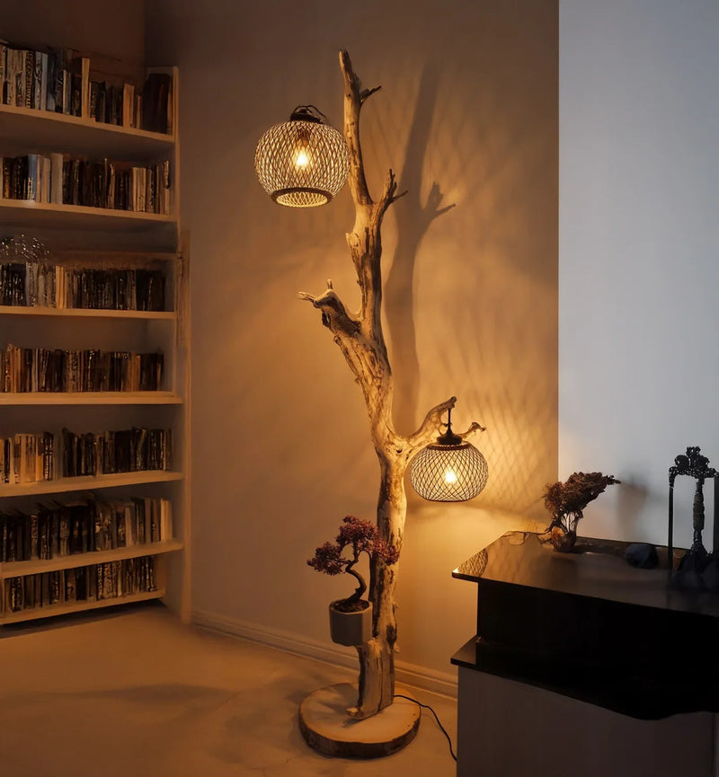 Sustainably crafted tree branch floor lamp with woven shades in cozy living room