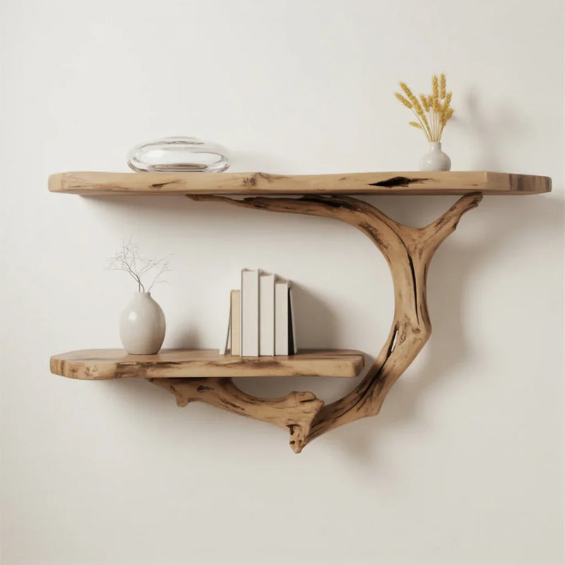 Wall-mounted natural wood shelves with books, ceramic vases, and decorative dried plants in minimalist decor