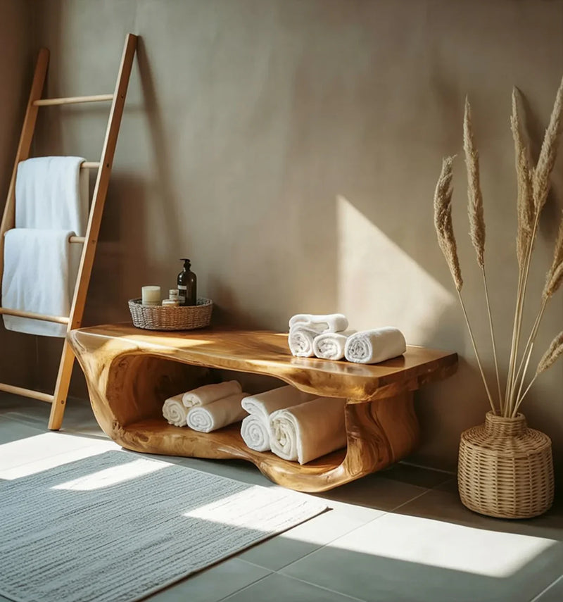 Live edge solid wood bench in a modern bathroom, rolled towels, and ladder towel rack