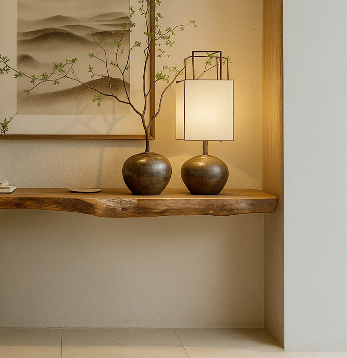 Minimalist wooden shelf with bronze vase holding a branch and matching lamp in cozy interior