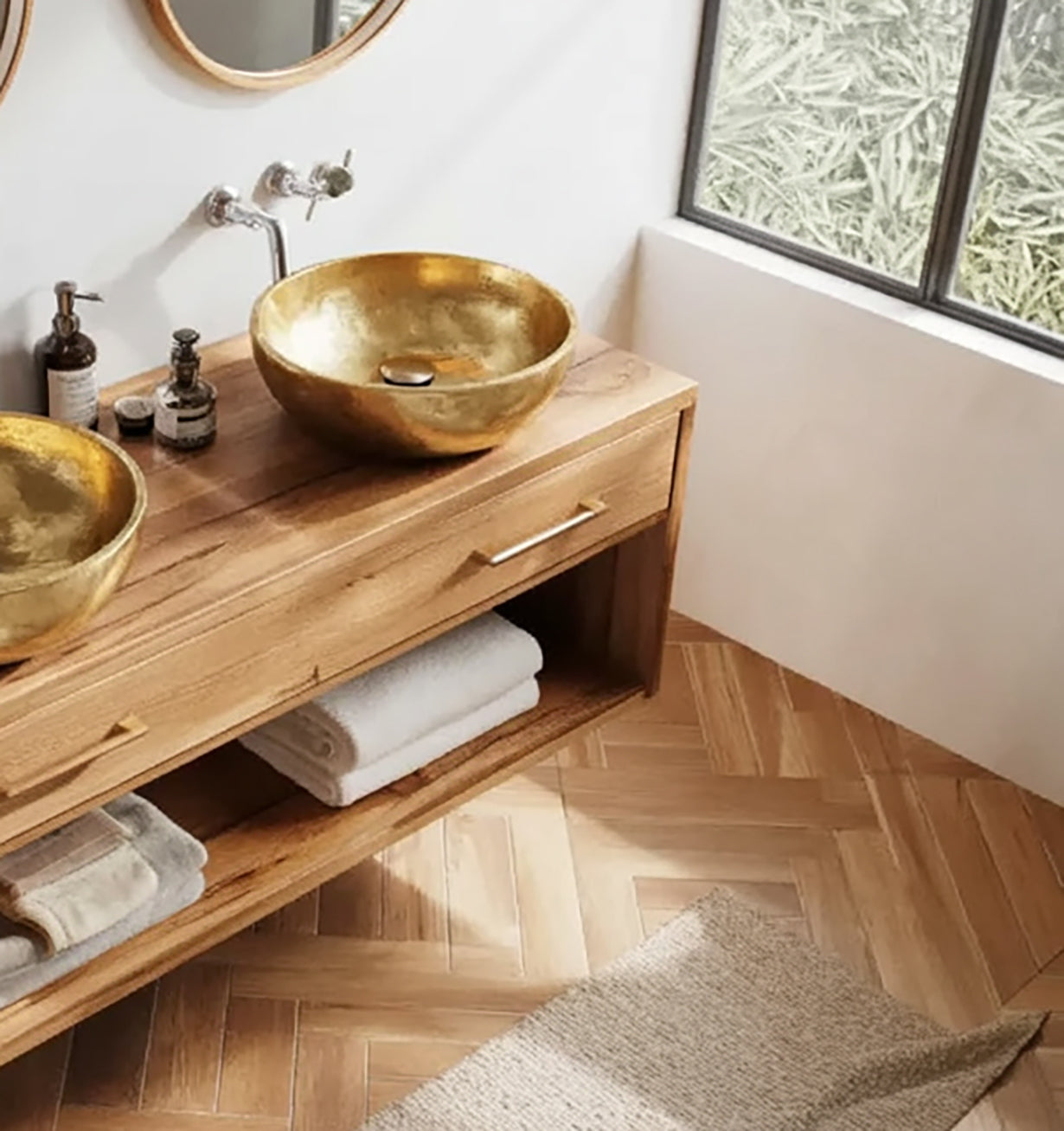Solid wood bathroom vanity with gold vessel sinks and modern decor
