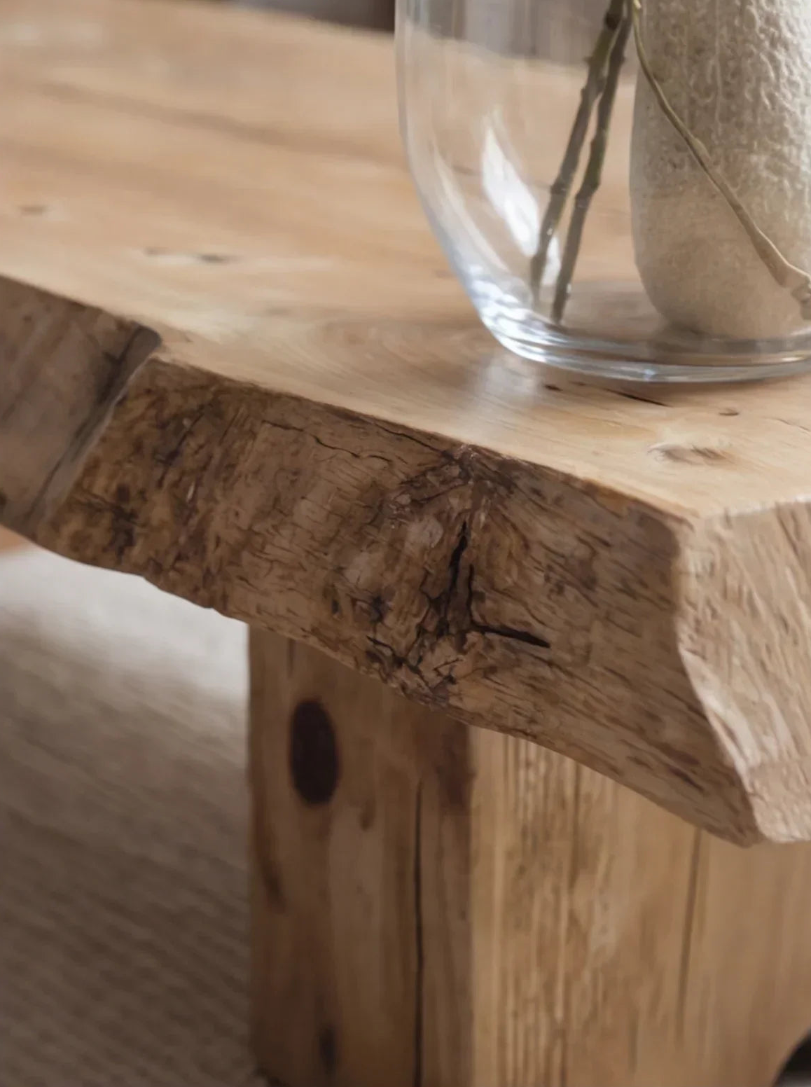 Live edge solid wood table with natural grain, glass vase on top, sustainable furniture