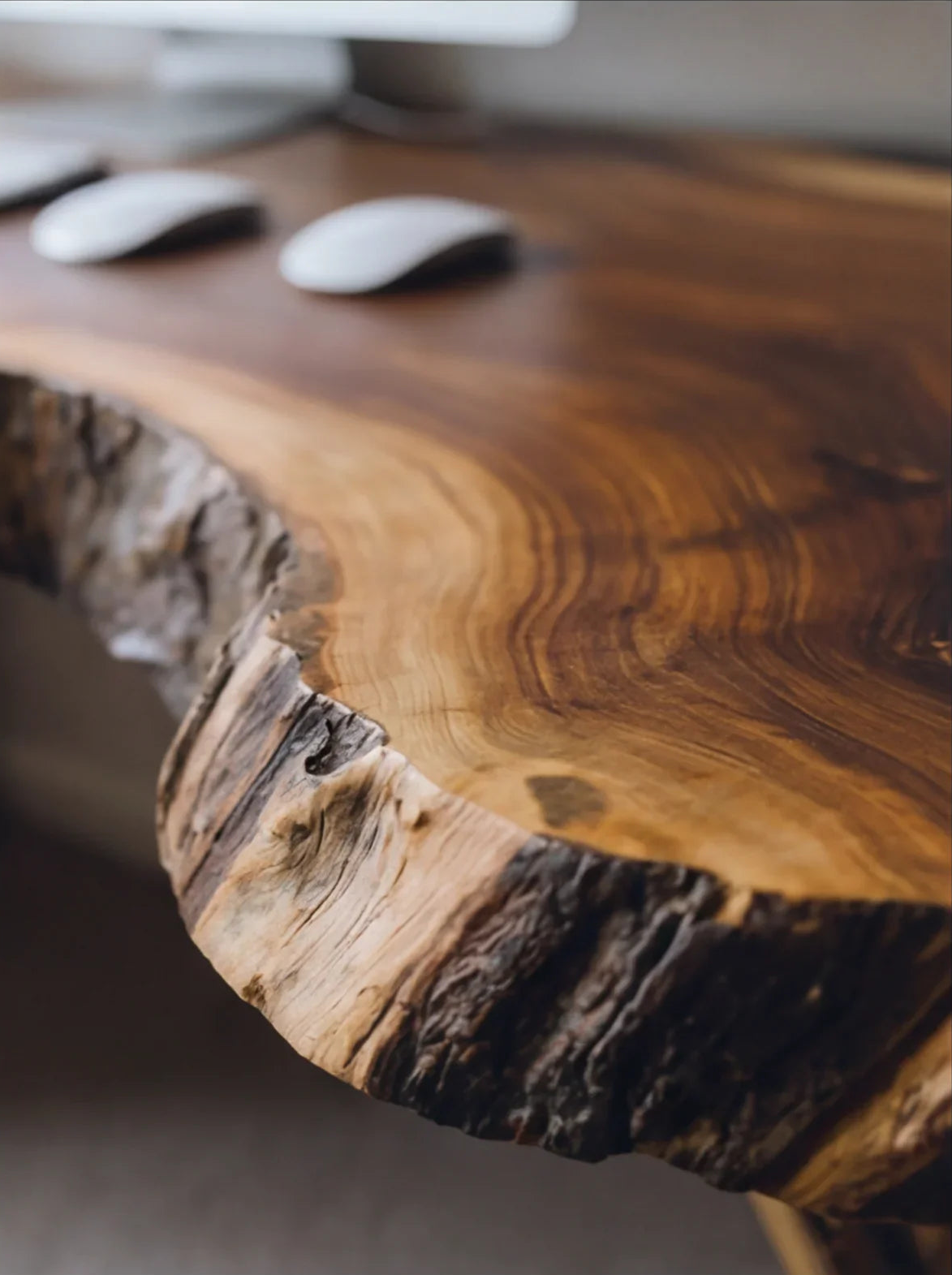Live edge solid wood desk with natural grain and bark, modern sustainable furniture