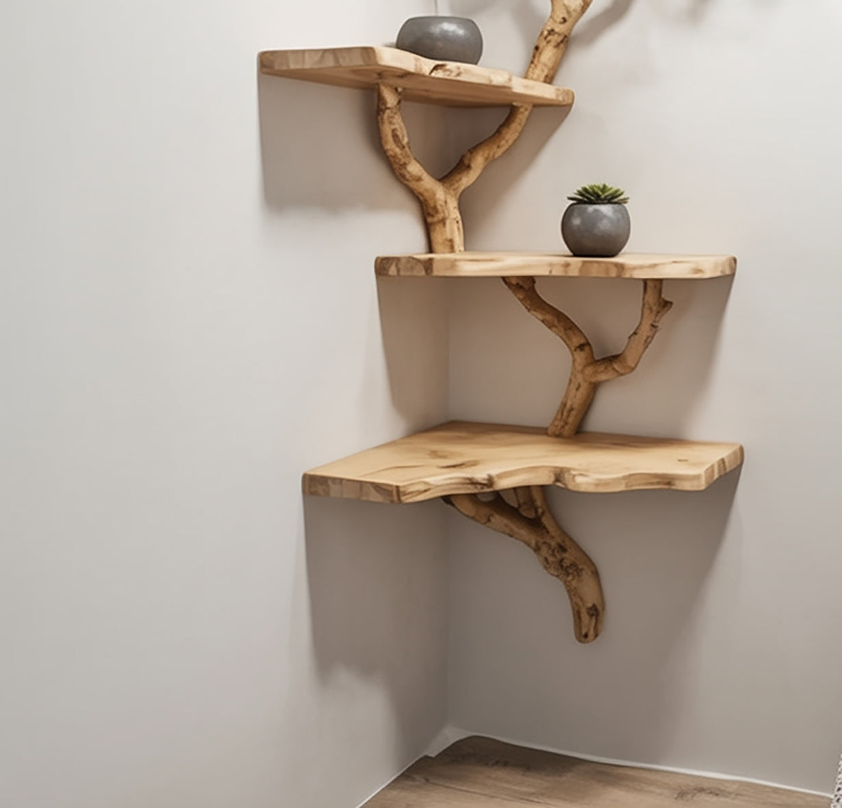 Corner-mounted wooden shelves with natural branch supports and small potted plants on a white wall