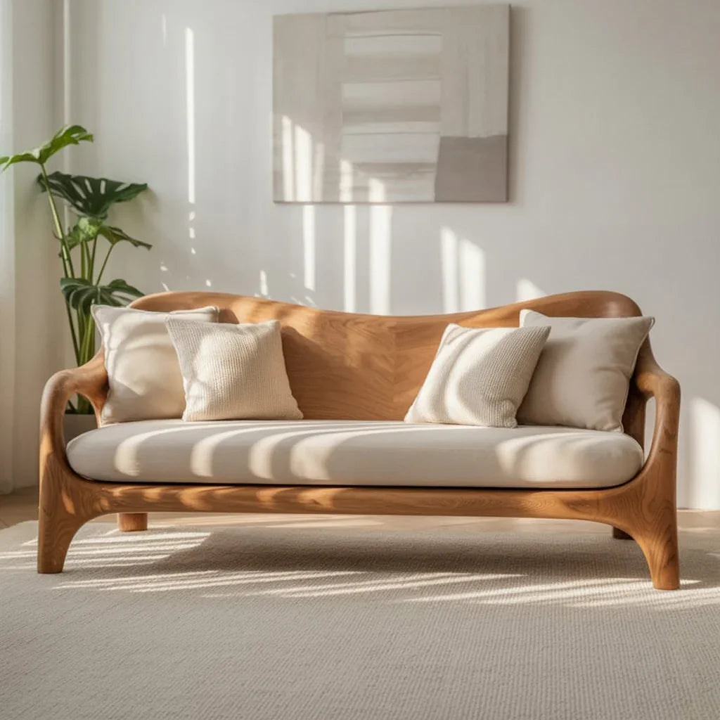 Solid wood sofa with beige cushions in a sunlit living room, minimalist decor