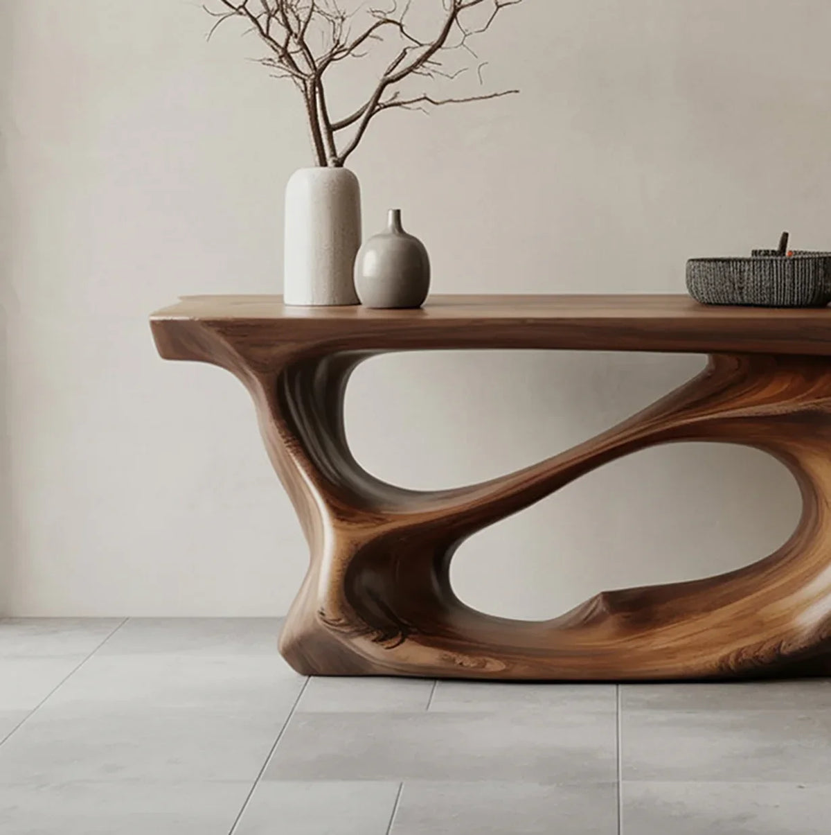 Live edge solid wood table with sculpted organic base and ceramic vases in modern room