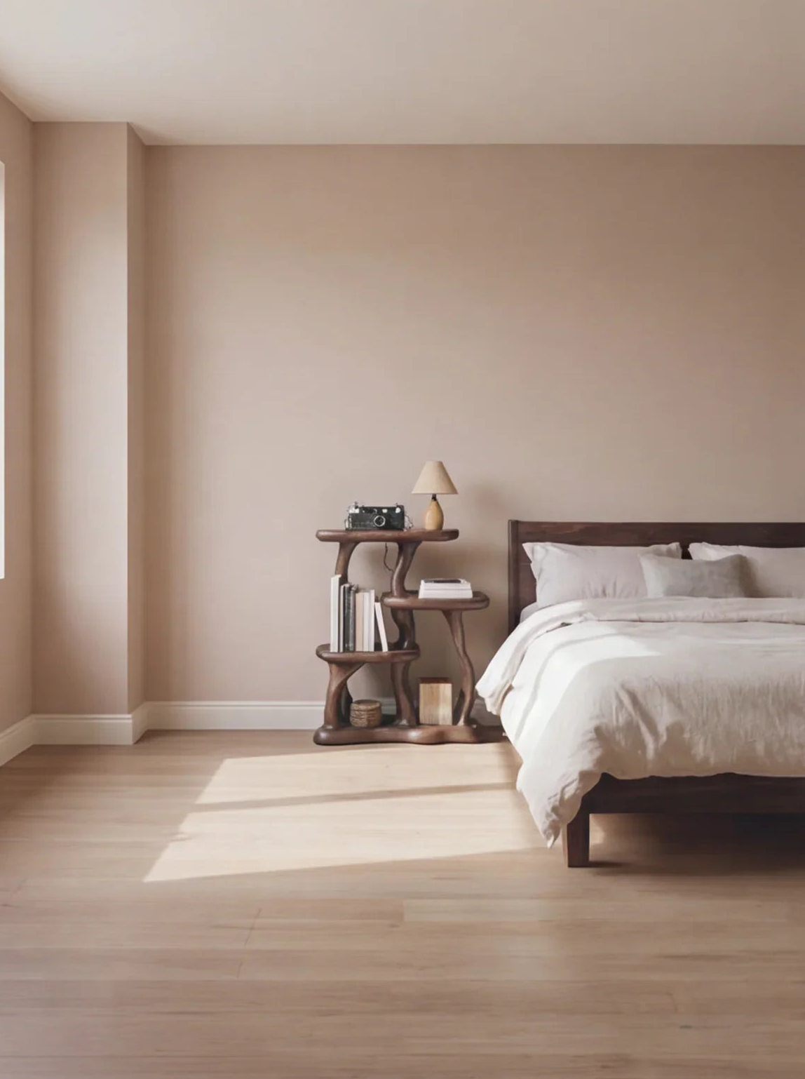 Minimalist bedroom with live edge wooden bed, unique solid wood bookshelf, and neutral decor.