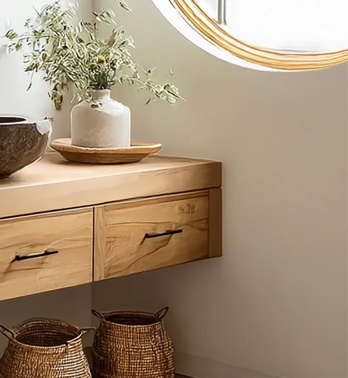 Solid wood floating shelf with drawers, ceramic vase, woven baskets in minimalist decor