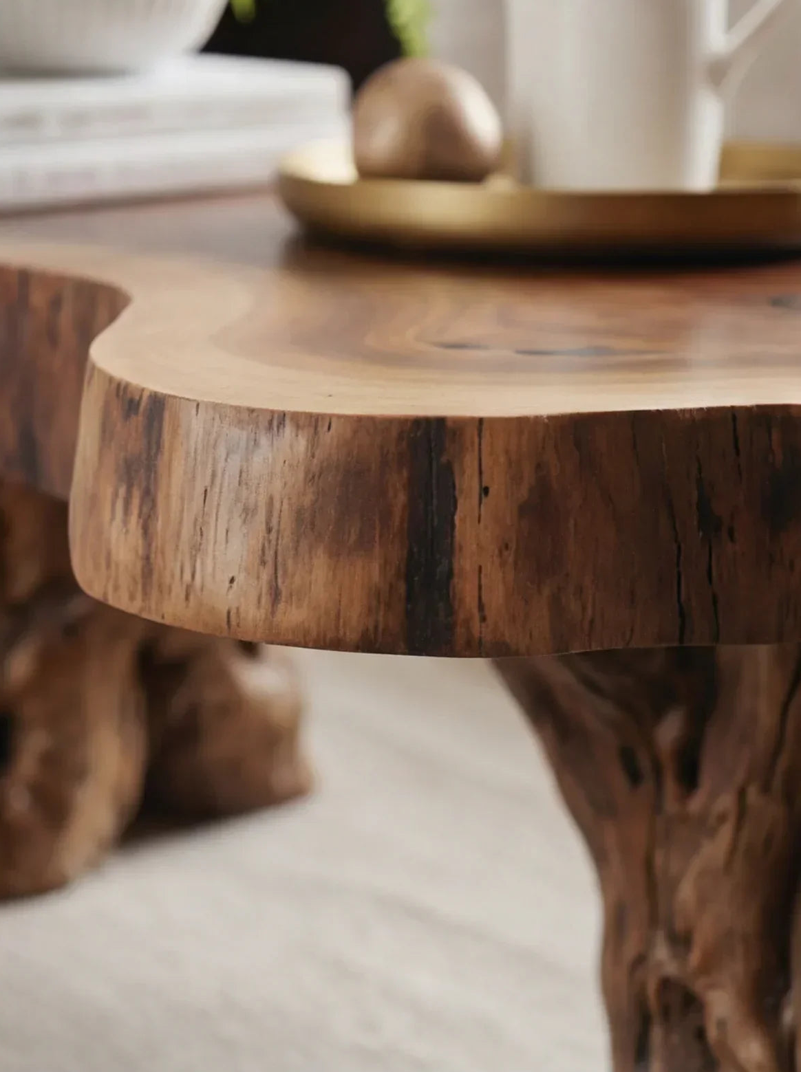 Close-up of live edge solid wood coffee table with natural grain and rustic base
