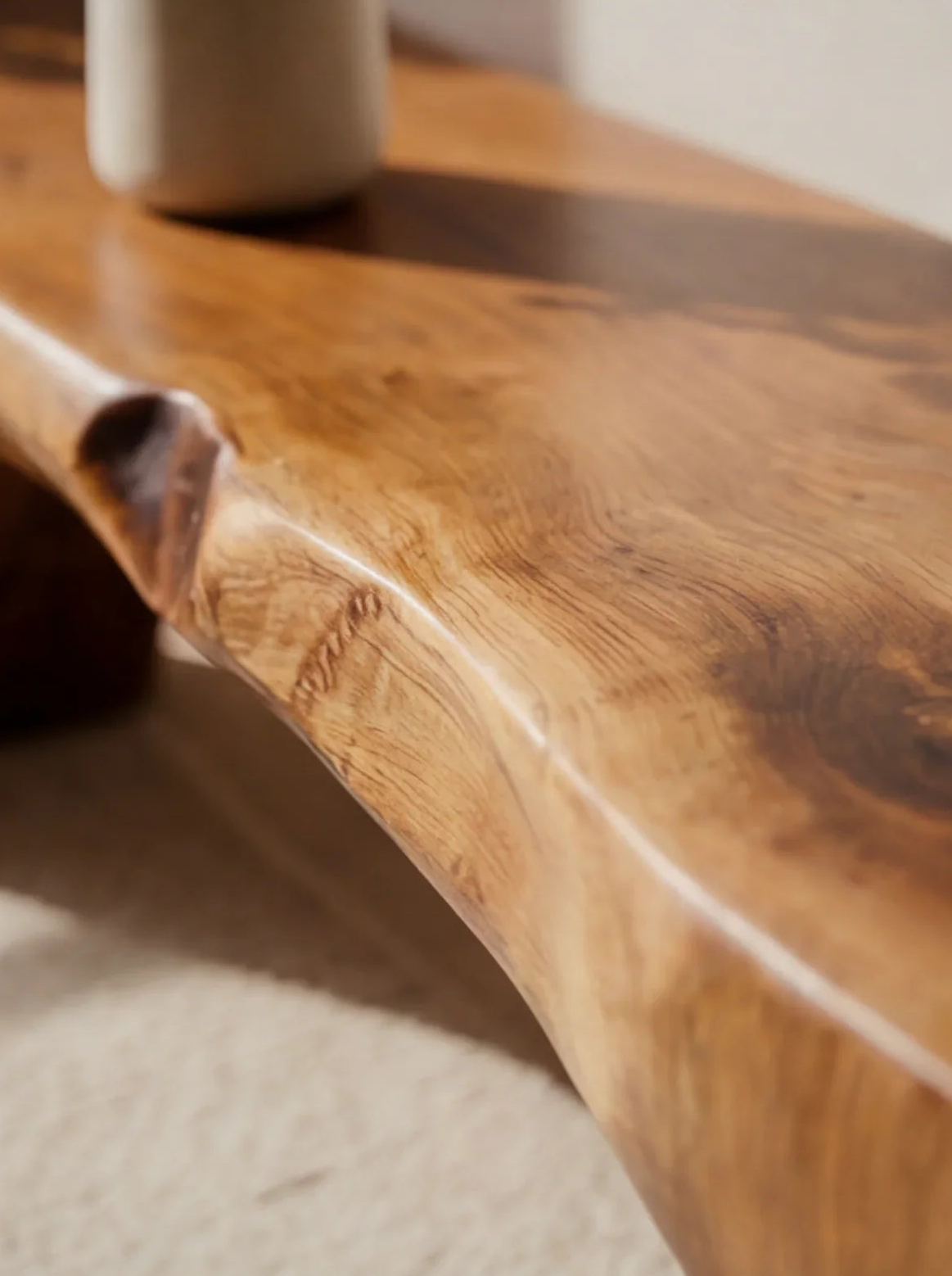 Close-up of live edge solid wood table with natural grain and smooth finish