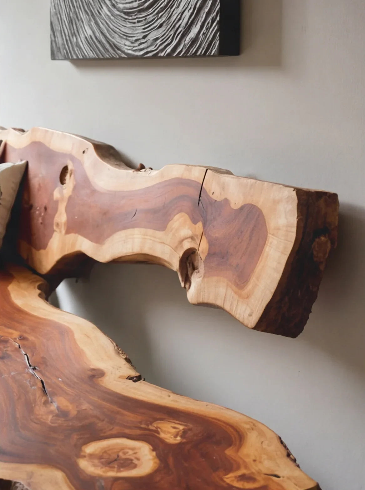 Live edge solid wood bench with natural grain against a light wall