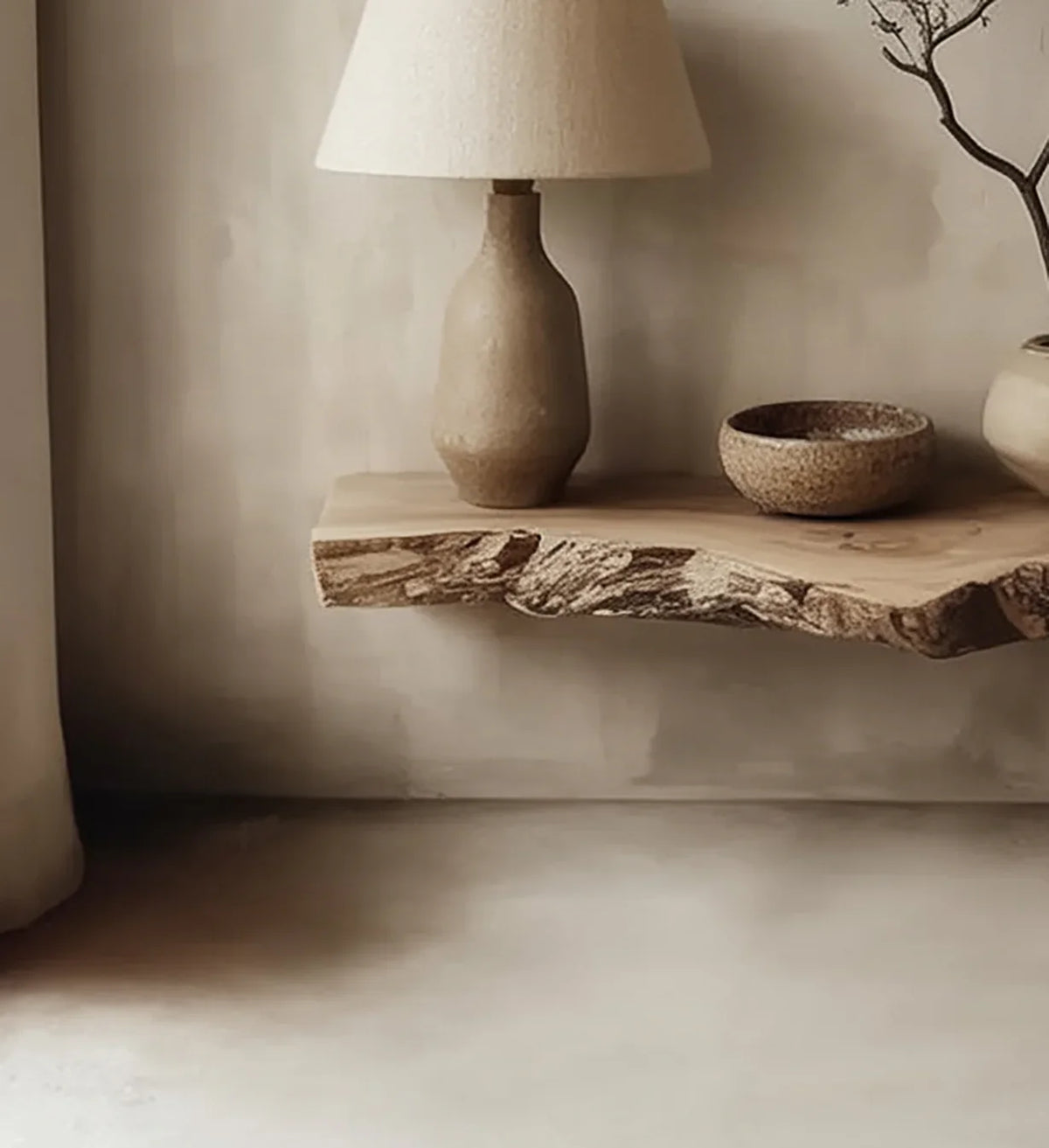 Live edge floating wood shelf with ceramic lamp and bowls, minimal home decor