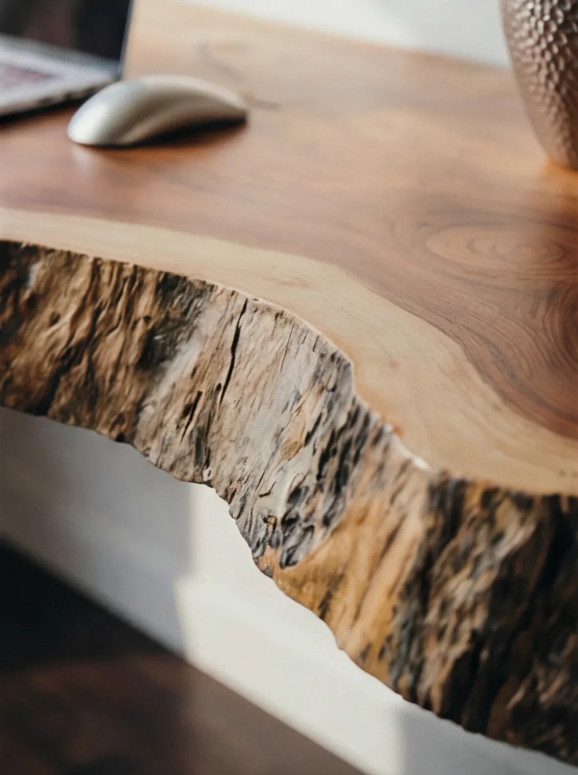 Close-up of a live edge solid wood desk with natural grain and organic edge detail