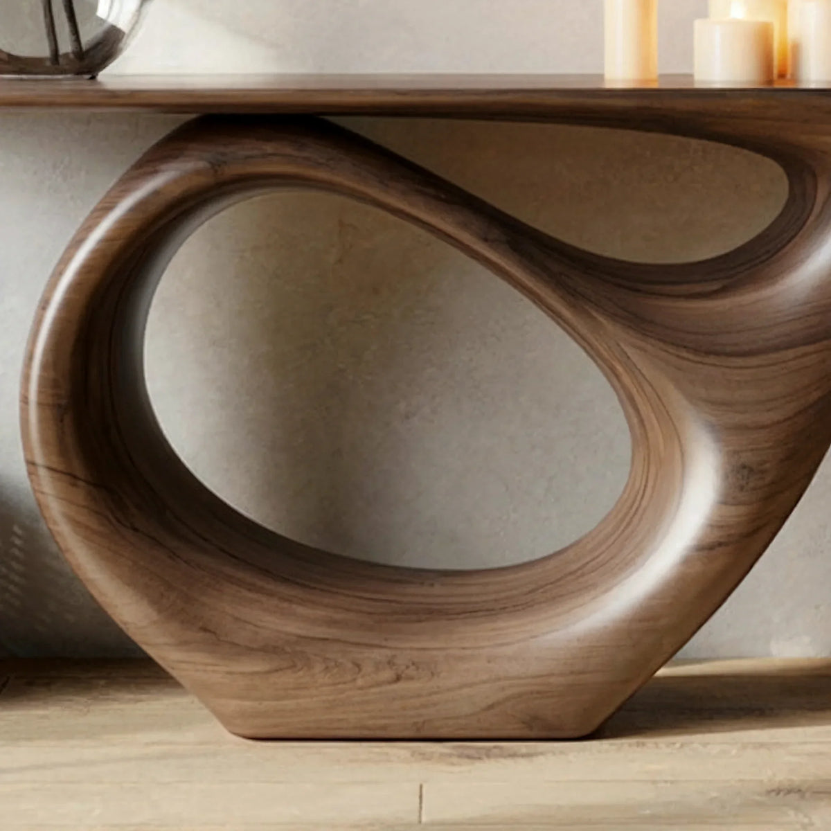 Sculptural solid wood console table with smooth, curved base and live edge top