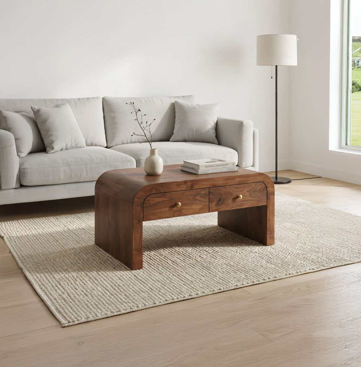 Organic modern solid wood coffee table with storage drawers in a minimalist living room