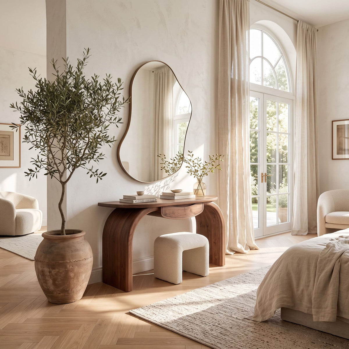 Curved waterfall arch vanity table styled in a modern bedroom