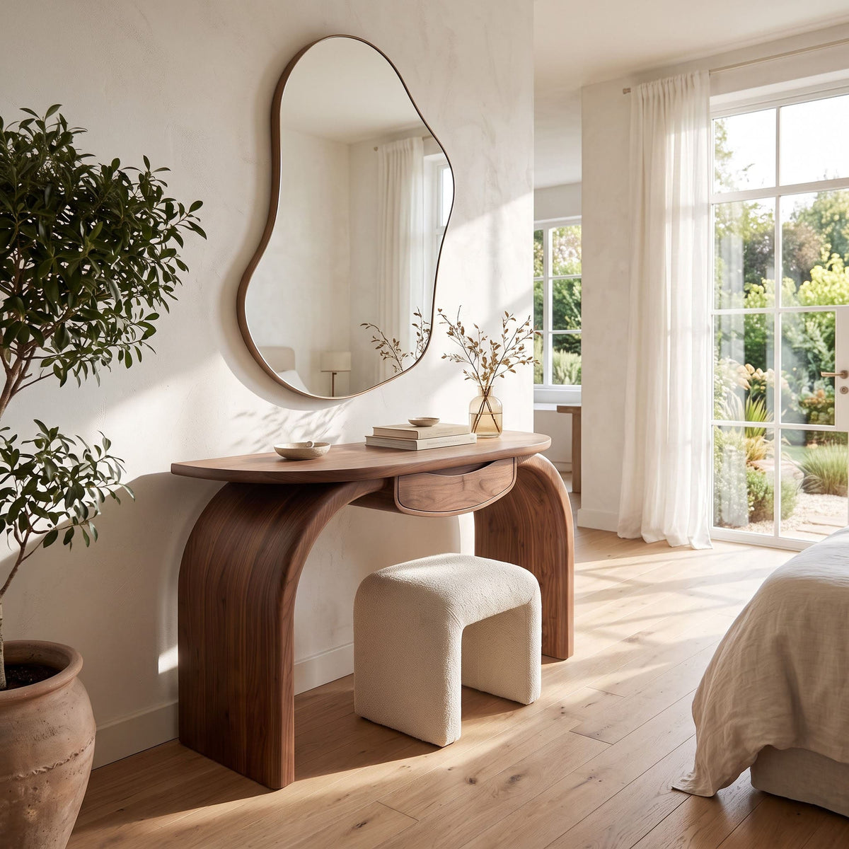 Curved wooden entryway desk creating a statement feature in a modern bedroom