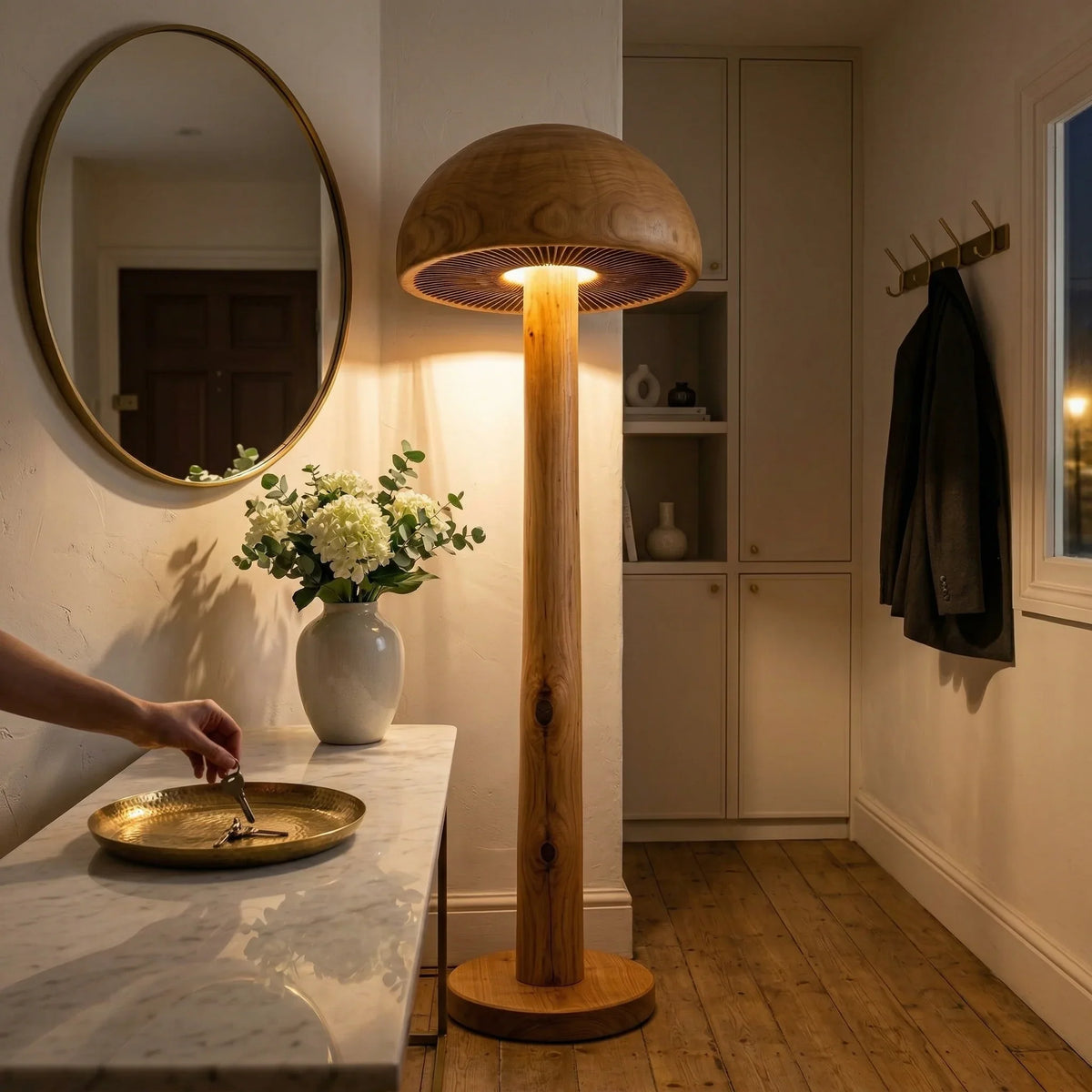 Mushroom-shaped solid wood floor lamp with carved gill detail in a cozy entryway setting