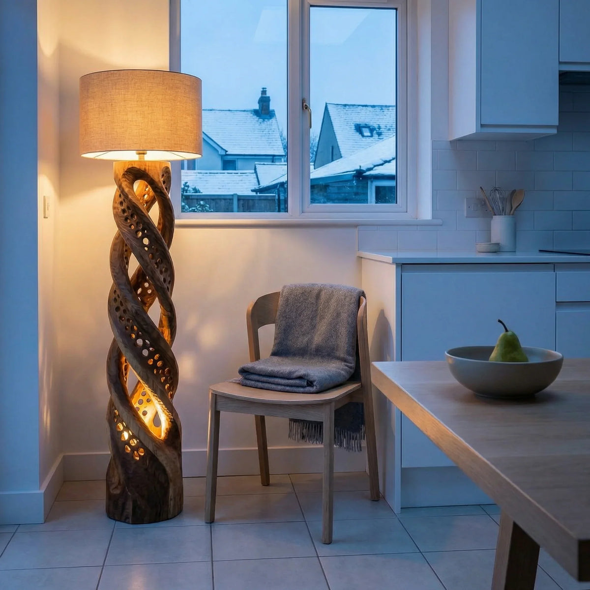 Double helix carved wood floor lamp with perforated light holes in cozy modern kitchen