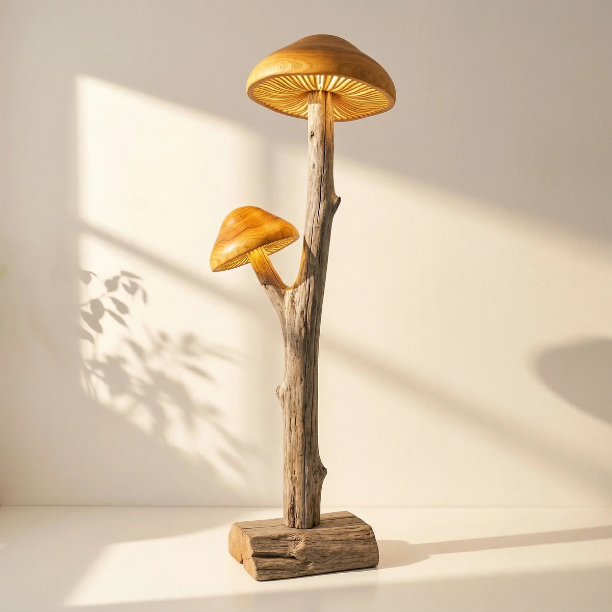 Dual mushroom floor lamp with hand-carved wood caps on natural driftwood base