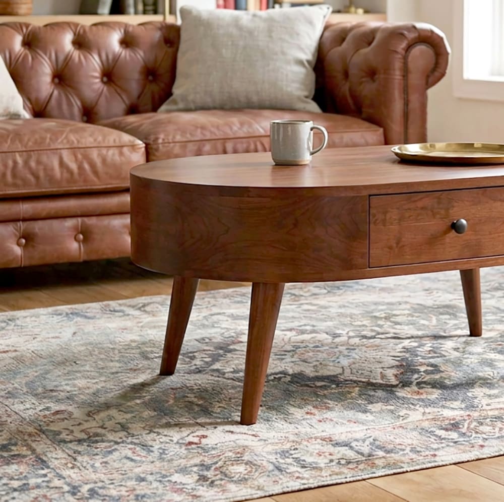 Japandi style solid wood coffee table featuring a sculptural curved design and built-in storage