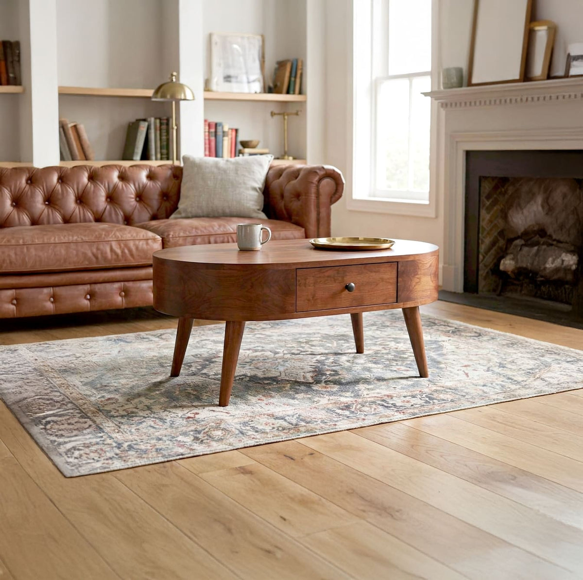 Curved solid wood coffee table with storage styled in a minimalist Japandi living room