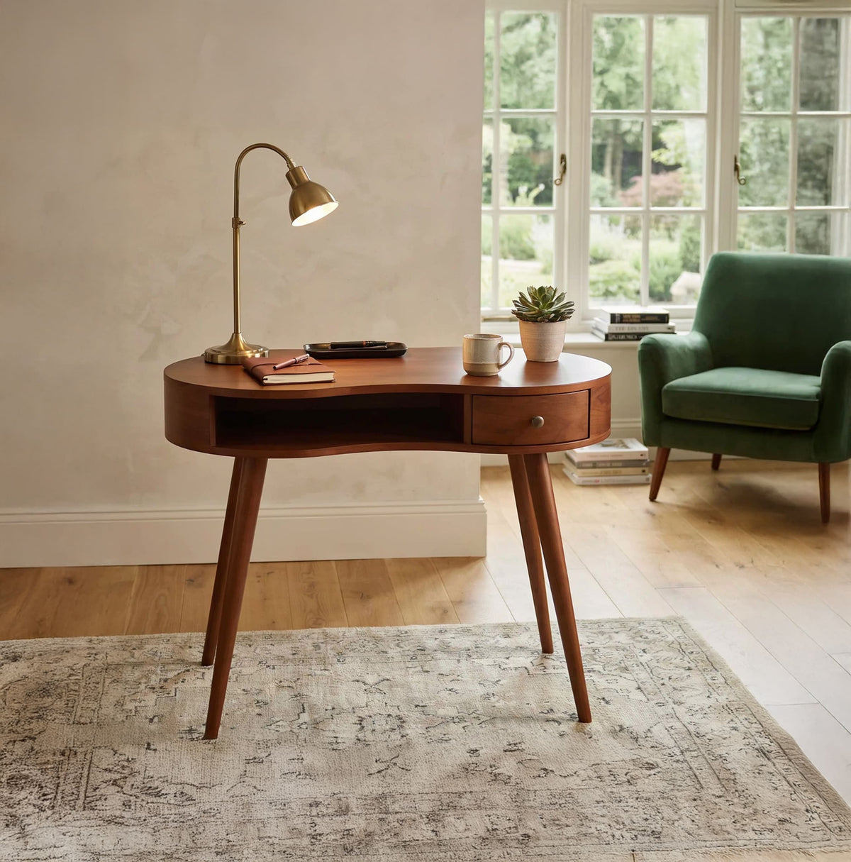 Curved solid wood desk table styled in a contemporary home office