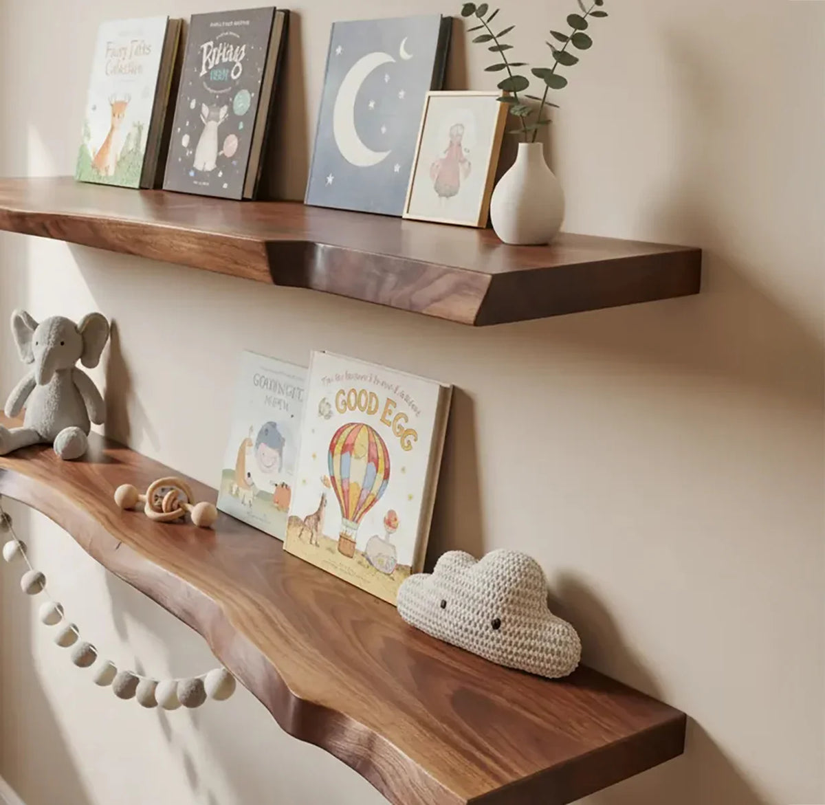 natural handcrafted floating nursery shelves with books and toys in a cozy baby room