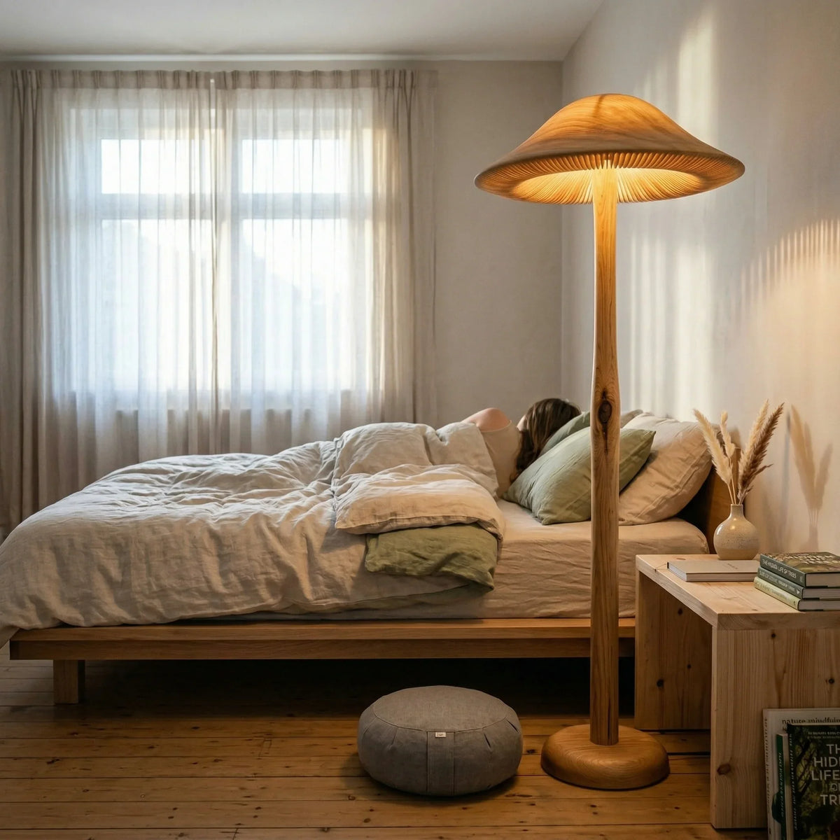 Golden mushroom floor lamp with wooden base in cozy minimalist bedroom
