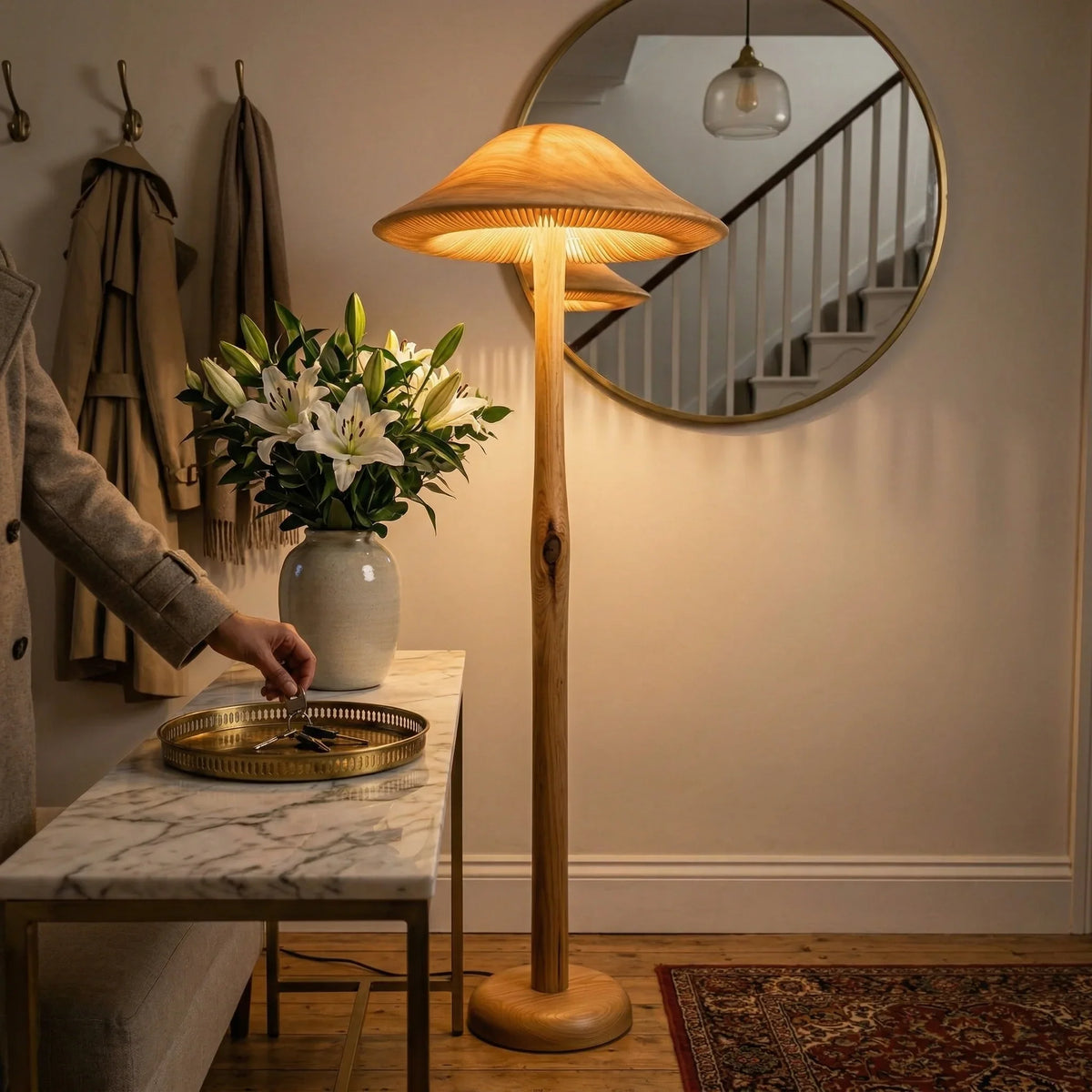 Golden mushroom-shaped floor lamp with wooden base in a cozy modern entryway