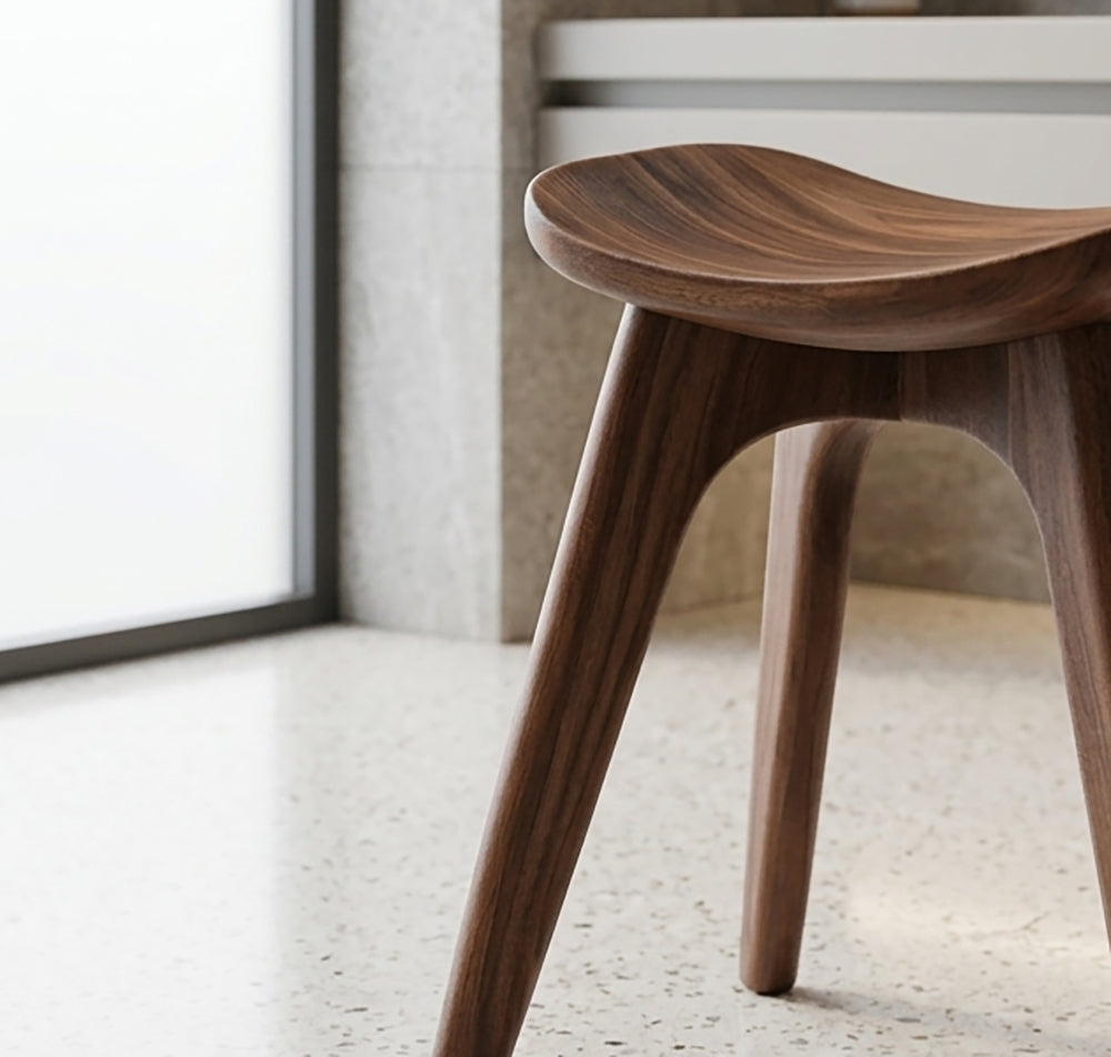 Solid wood shower stool featuring an organic sculptural design for modern bathrooms