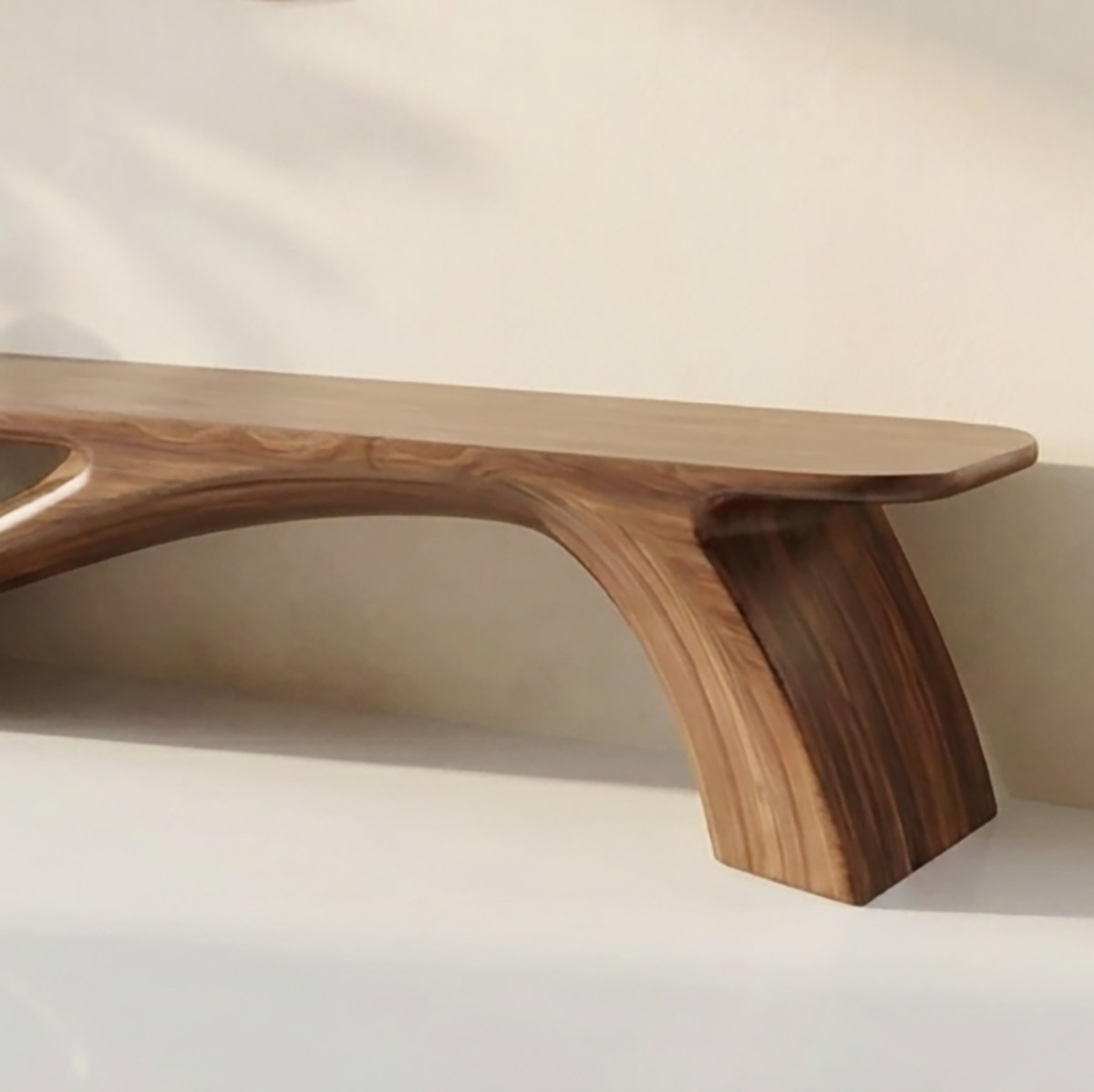Handcrafted wooden bench with flowing sculptural design