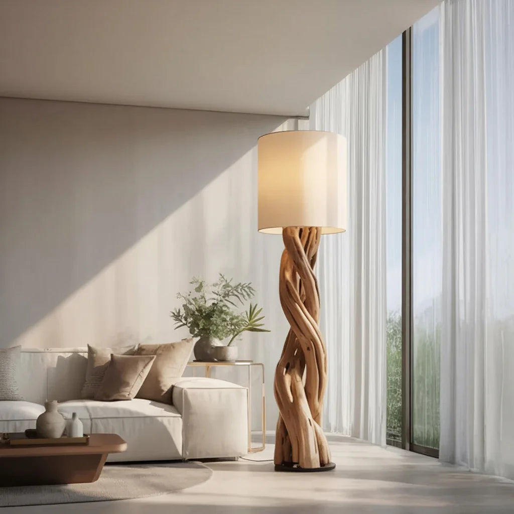 Modern living room with woven wood floor lamp, white sofa, neutral cushions, and large windows