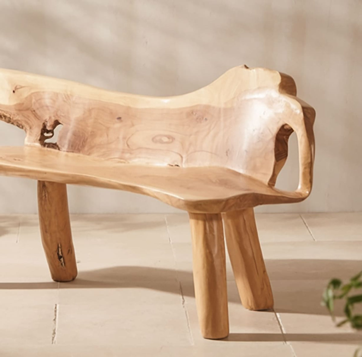 Rustic handcrafted outdoor bench with natural wood grain and full backrest